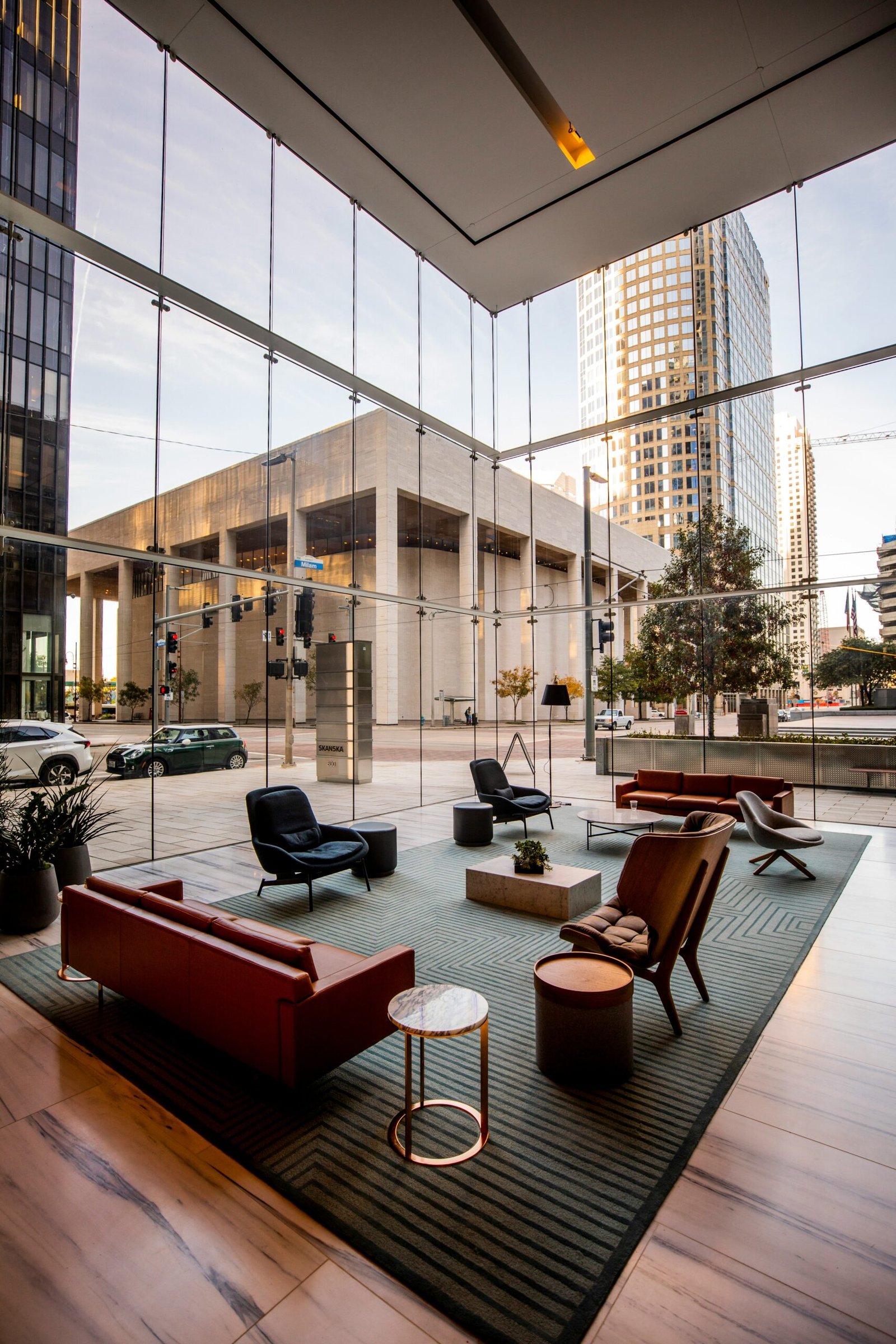 Modern corporate lobby with glass walls and city view representing a professional business environment
