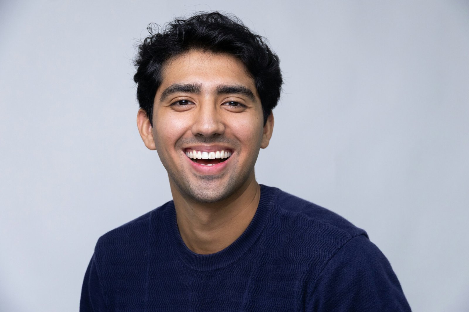 Smiling business professional headshot representing friendly and approachable consulting services
