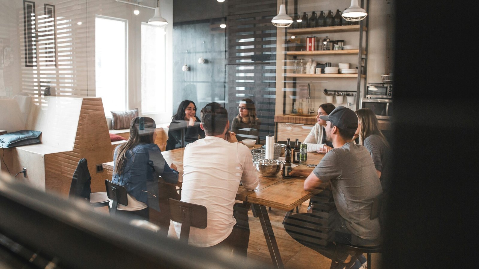 a group of people gather at conference room for office meeting